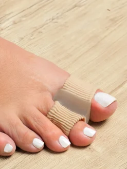 Protège et séparateur d’orteils double