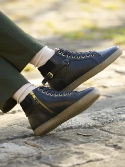 Sneakers montantes avec zip et lacets